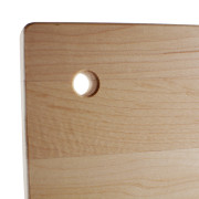 Small wood cutting board with a hole to hang it with.