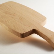 Small wooden bread board with handel profile