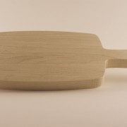 Small wooden bread board side view