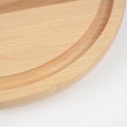 Small round cutting board with juice groove