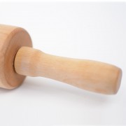 Large wooden rolling pin with handle.
