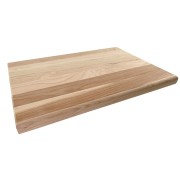 Image of a sturdy wooden cutting board resting on a kitchen prep table, ready for use in meal preparation.